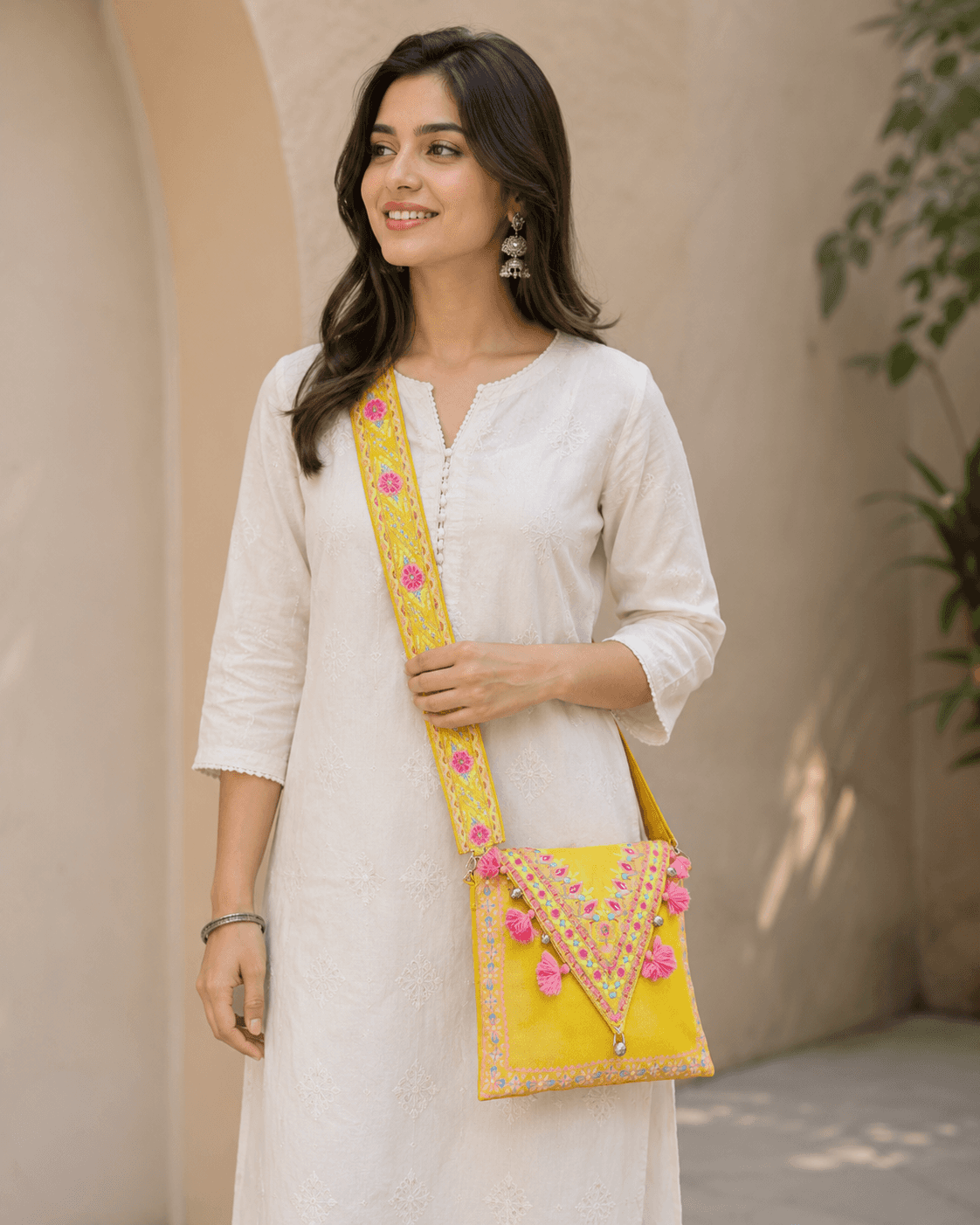 Yellow Structured Clutch by J. (junaid Jamshed)