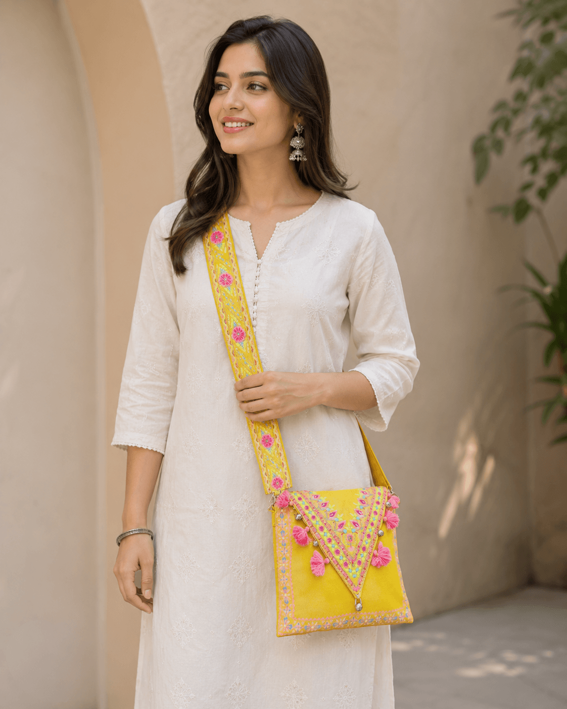 Yellow Structured Clutch by J. (junaid Jamshed)